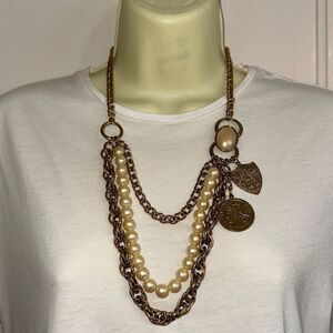 Triple strand  gold & pearl statement necklace with gold coin & crest pendant